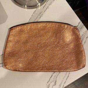 BAGGU rose gold and black leather wristlet